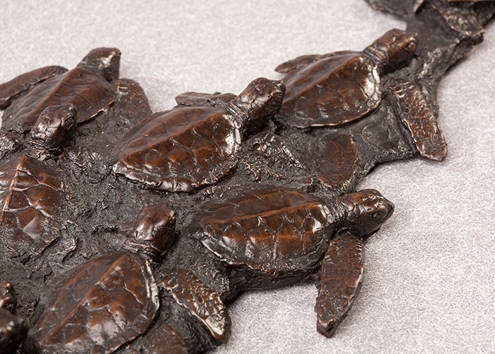 Mass hatching of baby sea turtles cast bronze sculpture