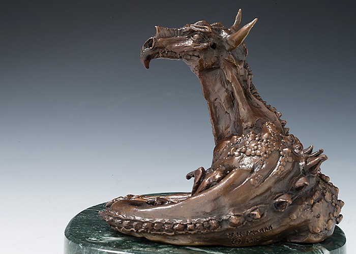 Resting Dragon in cast bronze on green marble base